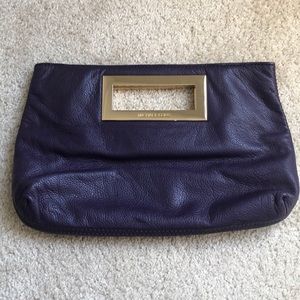 Michael Kors leather clutch in plum color